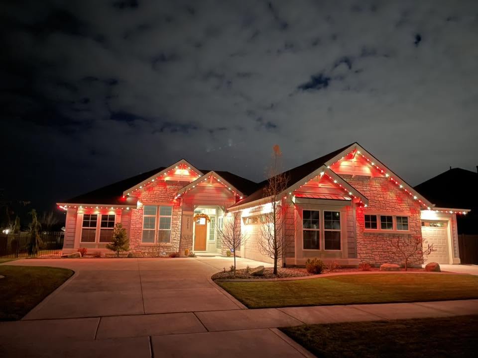 Home outlined in red and white permanent lighting